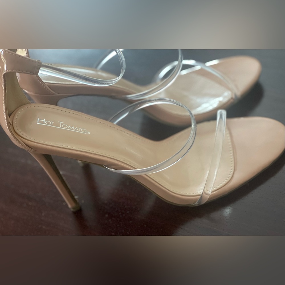 Nude heels with clear straps.